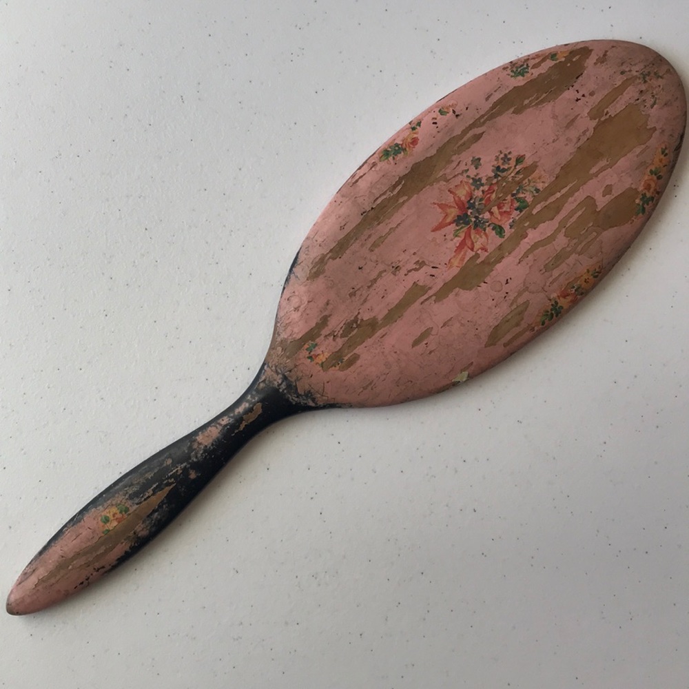 Vintage painted wood hand mirror.